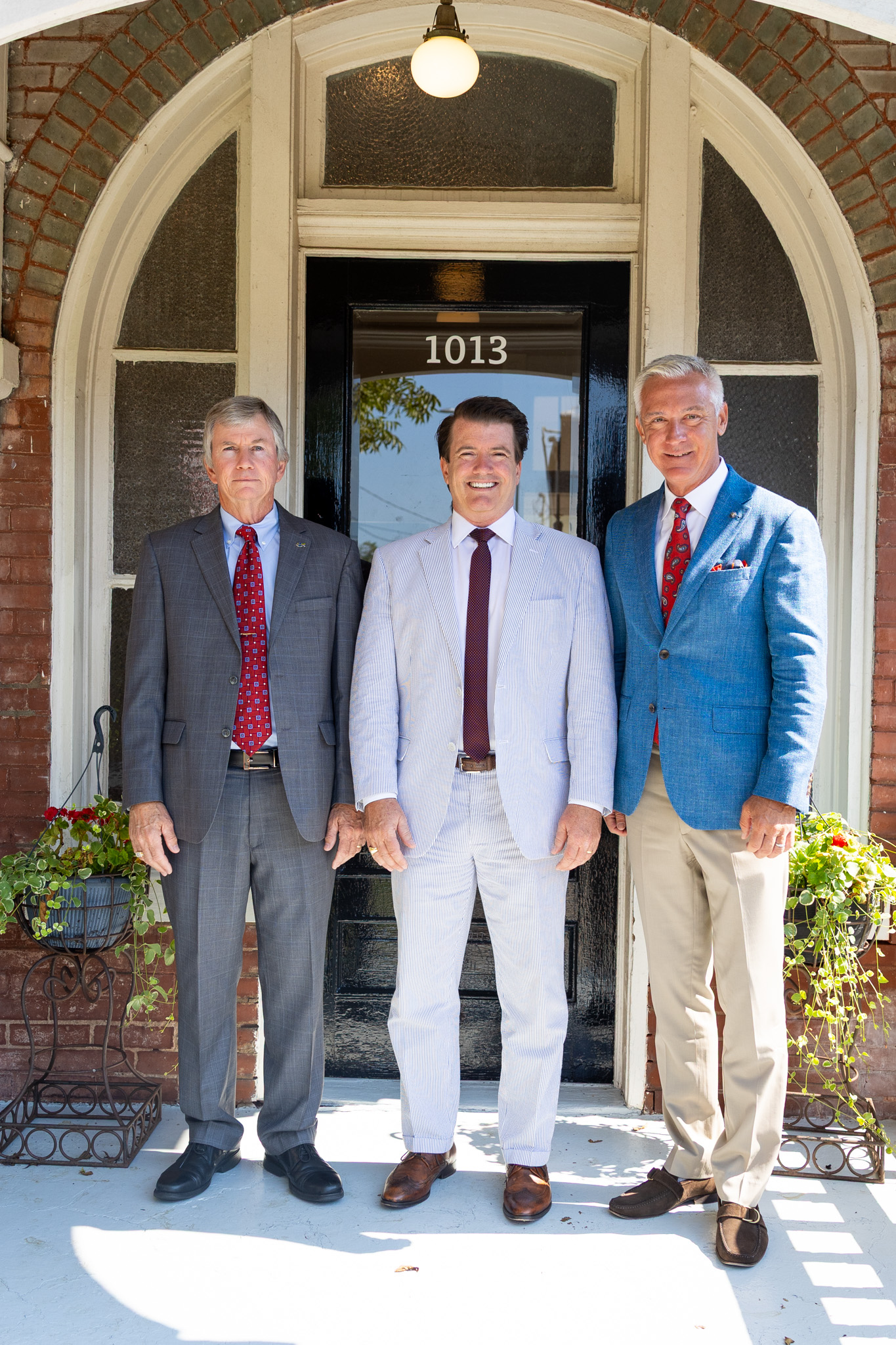 The firm’s attorneys outside the historic Oxford office
